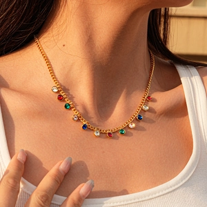 Gold stainless steel sweater chain with multi-color crystal drops worn on neck