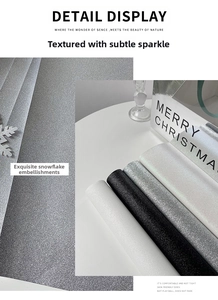 Close-up of sparkling glitter fabric rolls in white, black and silver for Christmas crafts