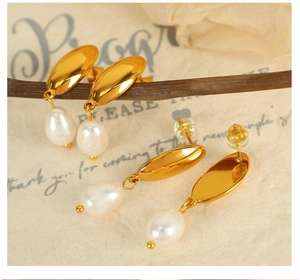 Detail of 18K gold crescent hoop earrings with white freshwater pearl drops on branches