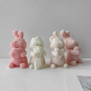 Handmade rose bunny scented candle molds in pink and cream for DIY gifts