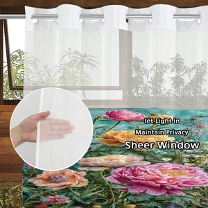 Floral sheer curtain with metal rings showing light filtering and privacy features