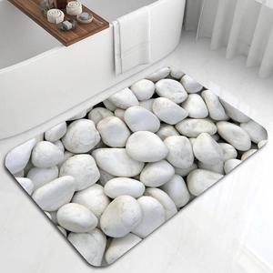 Detail of 3D white pebble pattern on absorbent diatom mud bathroom anti-slip floor mat