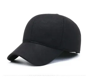 Detail view of the black wool baseball cap with silver Fashion metal emblem and curved brim