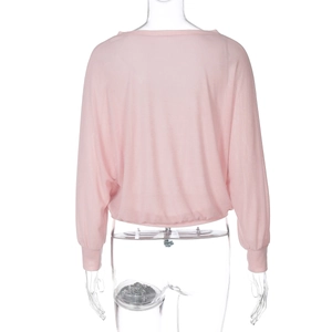 Detail view of pink sheer knit sun-protective top with back waist cinching design
