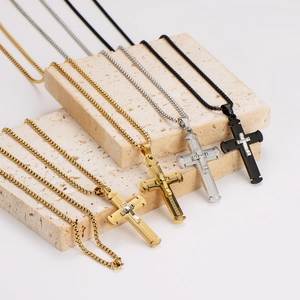 Minimalist stainless steel cross pendant necklaces in gold, silver, and black finishes