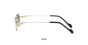 Side view of retro round sunglasses with gold frame and gray lenses showing temple detail