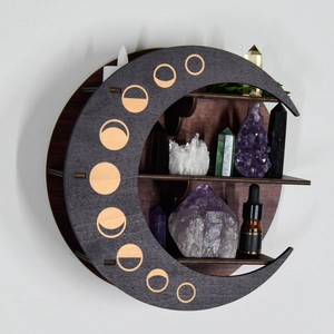 Detailed moon-shaped wooden shelf with moon phase patterns for crystal or candle display