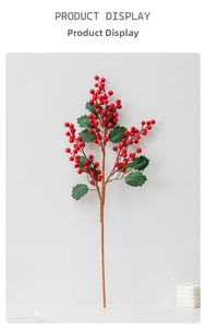 Detail showing artificial red holly berries with green leaves for Christmas decoration
