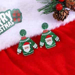 Detailed view of green sweater acrylic earrings with Santa Claus pattern and glitter finish
