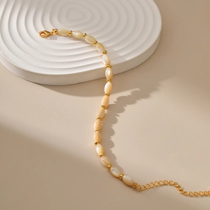 Irregular natural shell pearl bracelet with 18K gold beads and adjustable lobster clasp