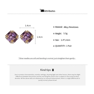 Detailed view of square purple crystal earrings with white silver needle and diamond accents