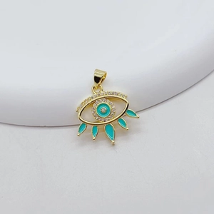Detail of gold Evil Eye pendant with turquoise enamel fringe and sparkling zircons