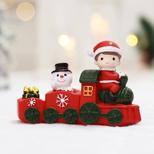 Christmas train decoration featuring Santa, snowman and gifts in festive red and green