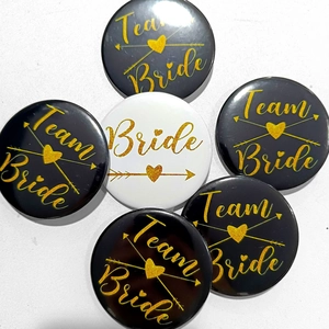 Set of 6 black and white Team Bride tinplate badges with gold heart and arrow details
