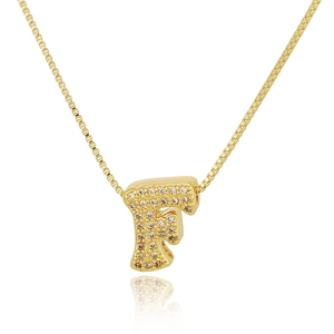 Macro view of gold letter F pendant necklace with sparkling cubic zirconia pavé stones