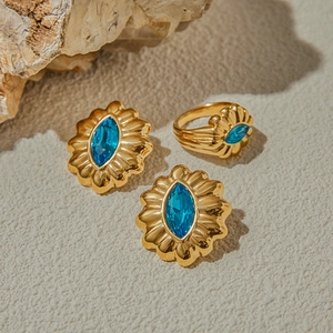 Golden titanium steel jewelry set with blue zircon stones in sunflower vintage design
