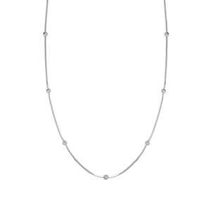 Detailed view of minimalist silver bead snake chain necklace with metallic luster