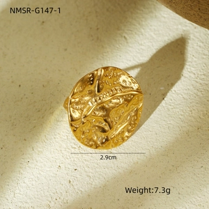 Detail view of gold hammered texture stainless steel ring showing 2.9cm diameter size