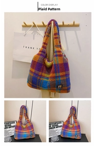 Close-up of colorful plush plaid tote bag showing purple and orange checkered texture