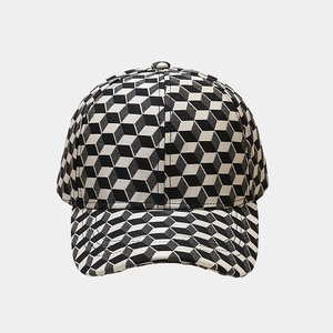 Baseball cap with black and white 3D geometric block pattern and classic curved brim