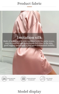 Detailed view of pink imitation silk robe fabric with washing instructions and satin texture