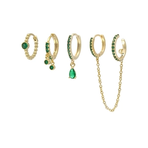 Detailed close-up of a 4-piece gold ear cuff set with green stones and chain fringe