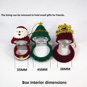 Detailed view of open Christmas jewelry boxes in Santa and tree shapes with inner lining