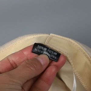 Detail view of the cotton and linen blend tag showing 30% linen and 70% cotton materials