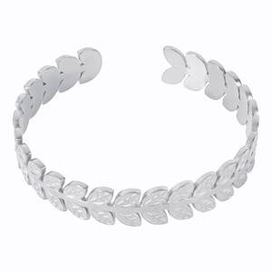 Close-up of a silver C-shaped olive leaf pattern cuff bracelet with an open design