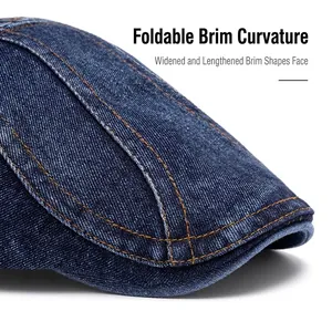 Deep blue denim flat cap with orange contrast stitching and foldable wide brim for sun protection