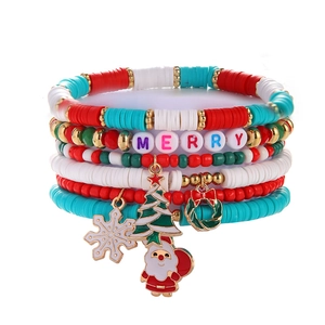 5-piece Christmas clay bead bracelet set with festive charms like Santa and tree