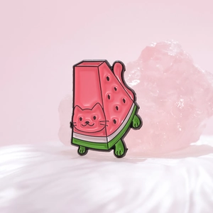 Creative enamel pin featuring a cute cat combined with a pink watermelon slice design