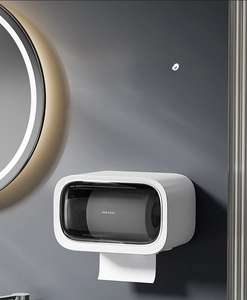 Detail of wall-mounted toilet paper holder with viewing window and waterproof cover