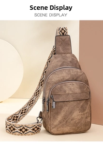 Detail of vintage brown chest bag showing multi-zipper pockets and ethnic woven strap