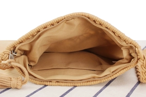 Detail of woven cotton bag featuring fabric lining, inner pocket, and zipper closure