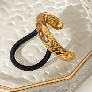 Modern gold hammer textured metal hair ring on black elastic tie, minimalist hair accessory