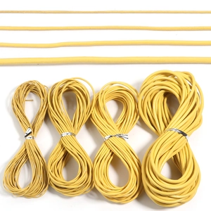 Detail showing four different diameters of bright yellow leather cords for DIY jewelry