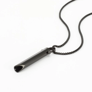 Macro shot of black stainless steel mindfulness breathing pendant with modern box chain