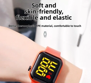 Detail of the soft orange TPE strap on this digital square LED wristwatch for kids