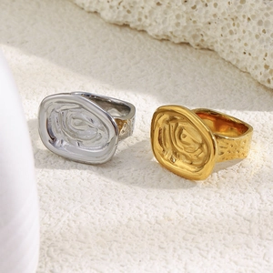 Minimalist 18K gold and silver plated rings with irregular spiral pattern and hammered texture