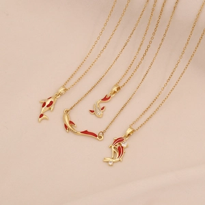 Golden stainless steel necklaces featuring red koi fish pendants with sparkling crystal accents