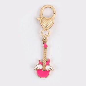 Pink guitar pendant with white wings and golden heart lobster clasp for keychains