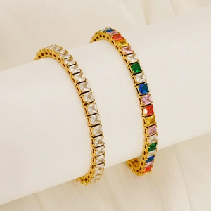 Elegant gold-plated tennis bracelets featuring clear and rainbow square-cut cubic zirconia