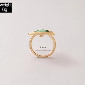 Detailed measurement of gold Christmas ring with green enamel, inner diameter 1.8cm, weight 6g