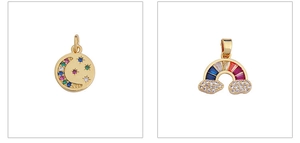 Detail of star-shaped pendant and rainbow cloud charm with colorful zircon inlay