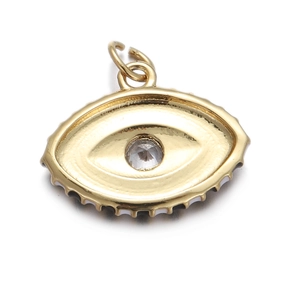 Detailed close-up of a gold-toned Evil Eye pendant with clear zircon and textured edges