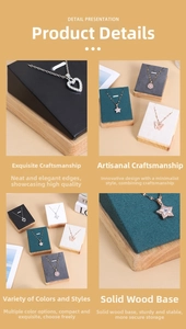 Detail view of wooden necklace display stands with premium leather and velvet finishes