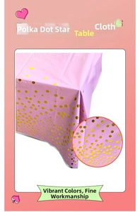 Close-up of pink party tablecloth with golden polka dots made of waterproof plastic material