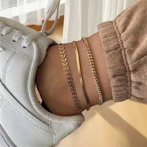 Three-piece 18K gold plated anklet set featuring leaf, snake, and classic round link chains