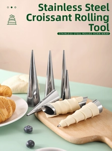 Set of stainless steel cream horn molds on a kitchen board for baking croissants